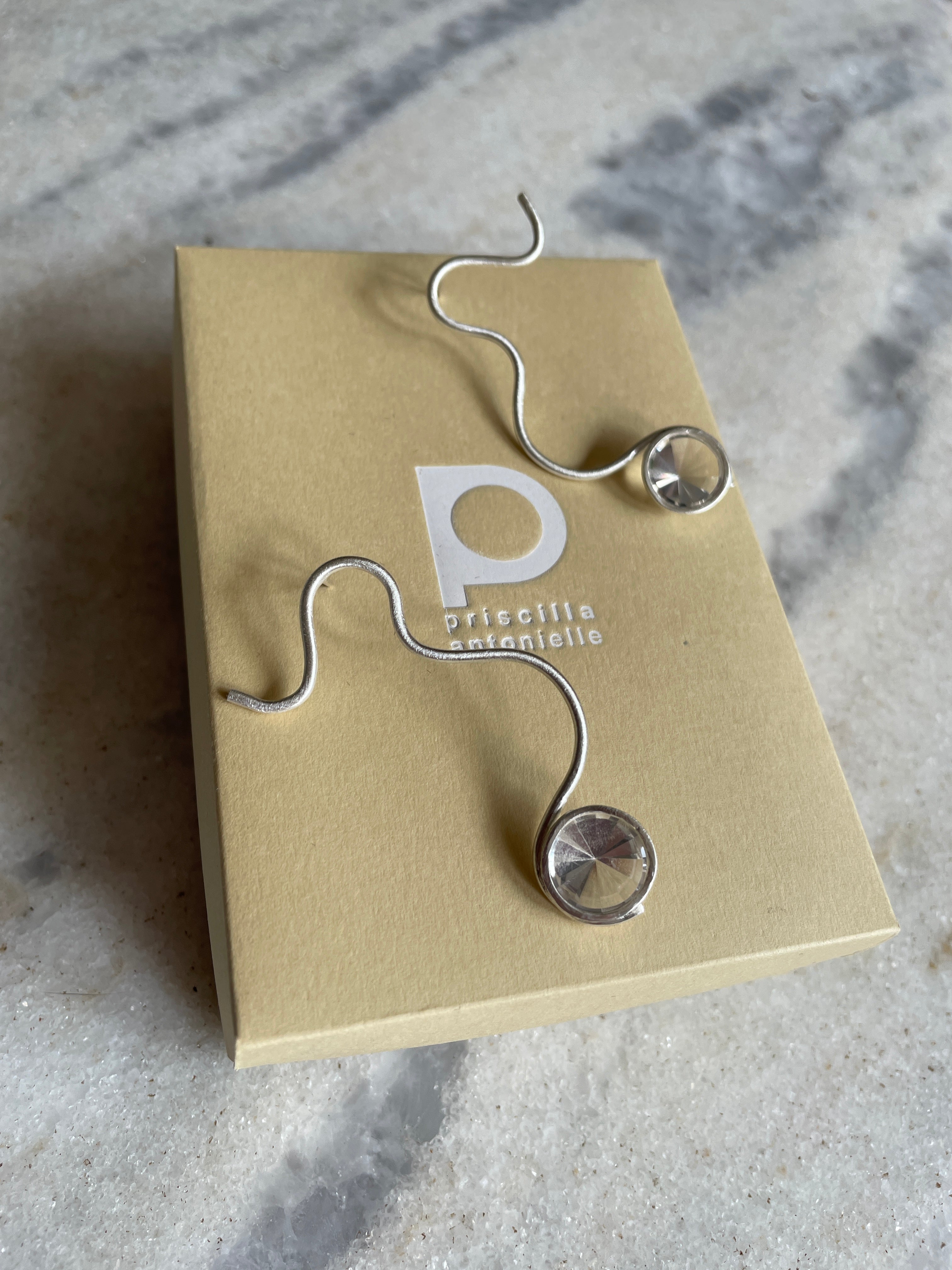 Brinco Rastros 1 quartzo branco